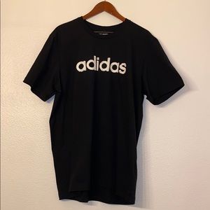 Adidas shirt. Unused. Black with adidas lettering.